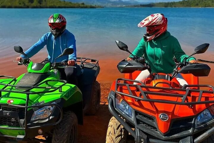 Colorful quad bikes by the lake