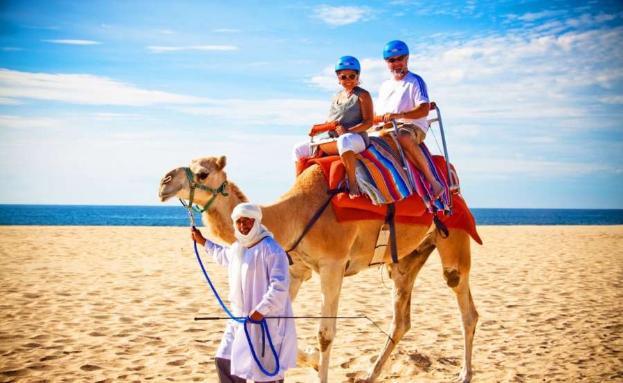 Tourists enjoying camel ride in Tangier